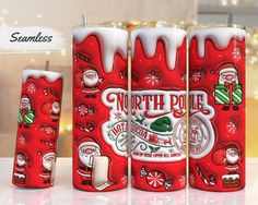 three red candles with santa clause designs on them