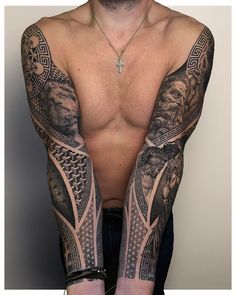 a man with tattoos on his arms and chest