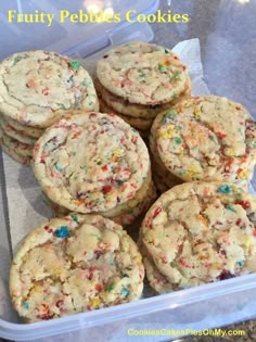 a plastic container filled with cookies and sprinkles