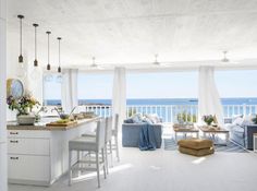 a kitchen and living room with an ocean view