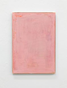 a pink square on a white wall