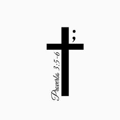 a black and white photo of a cross with the word jesus on it's side