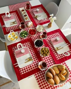 the table is set with red and white checkered cloth