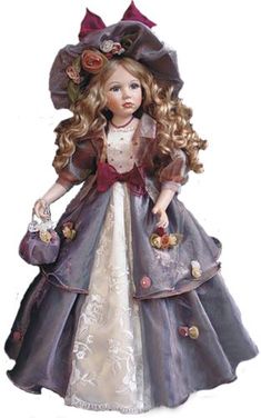 the doll is wearing a purple dress and hat