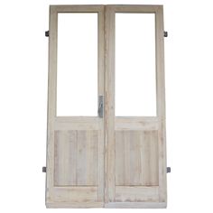 an open wooden door with two glass panels on the front and side doors in white wood