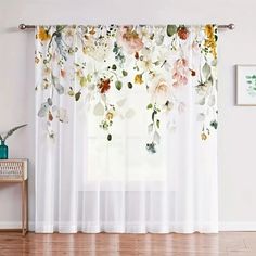 the curtains are decorated with flowers and leaves