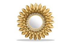 a mirror that is sitting on top of a white surface with gold leaves in the shape of a sunflower