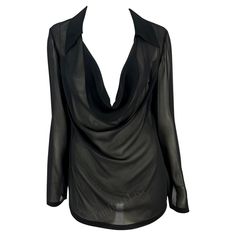 Presenting a fabulous black sheer Gucci blouse, designed by Tom Ford. From the Spring/Summer 1997 collection, this entirely sheer black top features a plunging cowl neckline, a fold-over collar, and lightly belled sleeves. Approximate measurements: Size - 44IT Shoulder to hem: 26.5" Bust: 34 - 42" Waist: 34 - 38" Shoulder to cuff: 25" Underarm to cuff: 18" 72% Rayon Viscose, 28% Silk Black Gucci Tops For Winter, Gucci Black Top For Spring, Black Cowl Neck Top For Night Out, Black Cowl Neck Top For Party, Sheer V-neck Top For Formal Occasions, Black Cowl Neck Top For Evening, Sleek Sheer Tops For Evening, Sleek Sheer Top For Evening, Evening V-neck Top With Sheer Sleeves