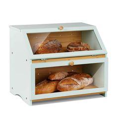 two wooden shelves with bread and pastries in them