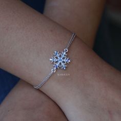 "PERFECT CHRISTMAS GIFT FOR LADY / GIRL You are getting a dainty Snowflake charm original rhodium plated bracelet attached to two fine cable original rhodium plated chains. Charm size is 5/8\" wide X 11/16\" high (16mm X 17mm) Color (Standard Swarovski Color Names): Light Sapphire, Sapphire AB The bracelet measures 7\" long (17.8cm) with 2\" extension chain (5cm). Prices are in US$. For shipping policies and other important information, click on \"profile\" on the right. See an item that you lik Elsa Stuff, Ice Spirit, Snow Jewelry, Ice Bracelet, Winter Angel, Theatre Production, Snowflake Bracelet, Snowflake Jewelry, Double Chain Bracelet