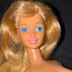 a doll with blonde hair and blue eyes