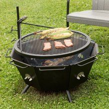 an outdoor grill with corn on the cob