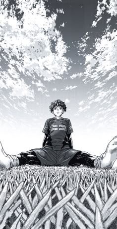 a man sitting on the ground with his legs crossed in front of him, looking up into the sky