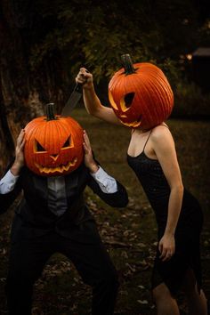 two people dressed up as jack - o'- lantern and one holding a knife