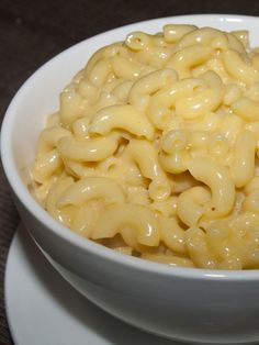 a white bowl filled with macaroni and cheese