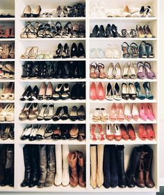 there are many pairs of shoes in the closet