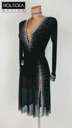 a black dress with silver sequins on it