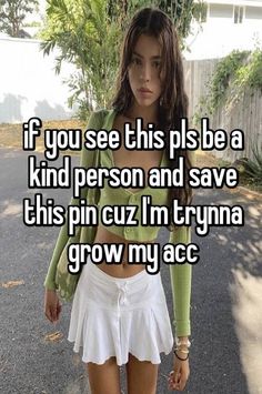 a girl in white skirt and green shirt walking down the street with her hand on her hip