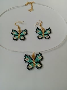 three pieces of beaded jewelry on a white surface