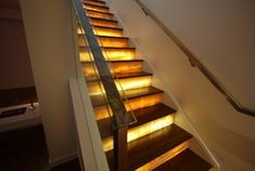 the stairs are lit up with yellow lights