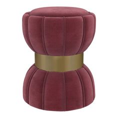 a red velvet stool with gold trimmings and a round cushion on the top