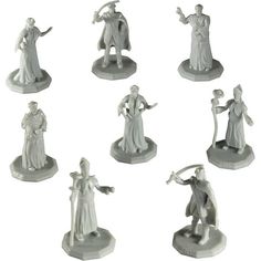 seven wizard figurines in various poses on a white background