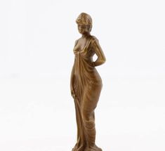 a statue of a woman standing with her hands on her hips and looking to the side