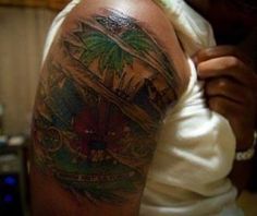 a man with a tattoo on his arm