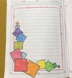 an open notebook with colored papers on it