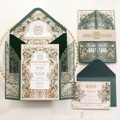 the wedding stationery is green and white with gold trimmings, along with an ornate gate design