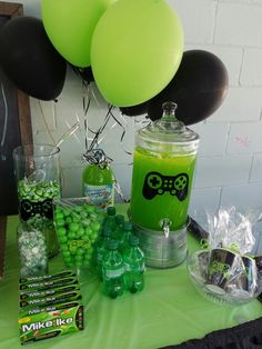 a table topped with balloons and candy