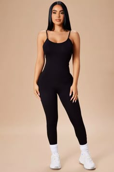 Trendy Stretch Jumpsuits And Rompers With Seamless Design, Casual Stretch Jumpsuits And Rompers With Built-in Bra, Casual Jumpsuits And Rompers With Built-in Bra And Stretch, Casual Black Seamless Jumpsuits And Rompers, Sleeveless Black Unitard For Loungewear, Stretch One-piece Jumpsuit For Loungewear, Casual Elastane Unitard For Loungewear, Fitted Seamless Jumpsuits And Rompers For Loungewear, Casual Seamless Fitted Jumpsuits And Rompers