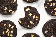 chocolate cookies with white and brown toppings on top