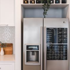 a silver refrigerator freezer sitting inside of a kitchen