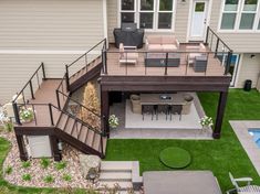 an aerial view of a deck and patio area in a home's back yard