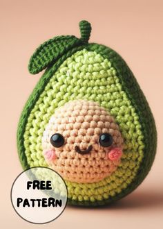 a small crocheted green bag with a face on it's side and the words free pattern below