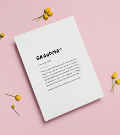 a white paper with the word grandpaa on it surrounded by yellow flowers and leaves