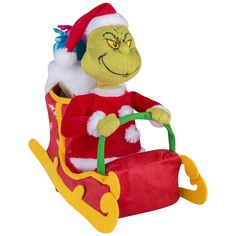 the grinch is riding in a toy sleigh