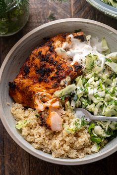 a bowl filled with rice, meat and vegetables