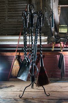 a bunch of tools are hanging on a rack