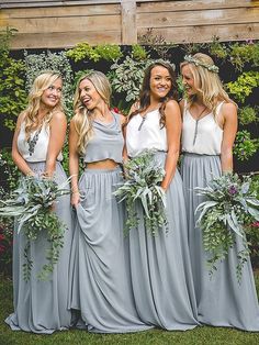 the bridesmaids are all wearing matching dresses