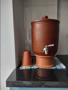 a brown pot sitting on top of a counter