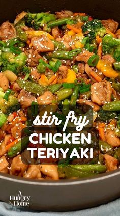 stir fry chicken and veggies in a pan with sesame seeds on the side