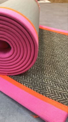 the yoga mat is rolled up and ready to be used as a mat for exercise