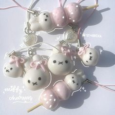 some white and pink items with bows on them are arranged in the shape of rabbits