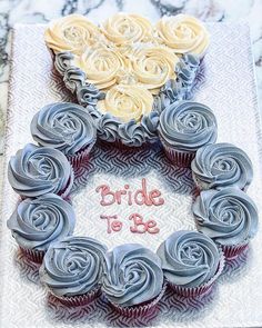 a wedding cake made to look like cupcakes with the words bride to be written on it