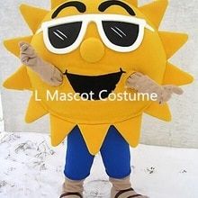 a yellow sun mascot with sunglasses on it's face and arms, standing in the snow