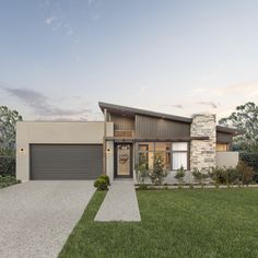 a modern house with grass and trees in the background