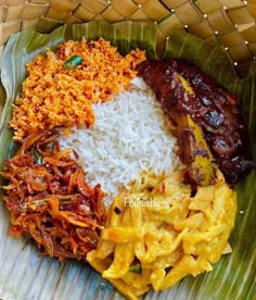 a plate with rice, meat and other foods on it in a woven basket next to a banana leaf