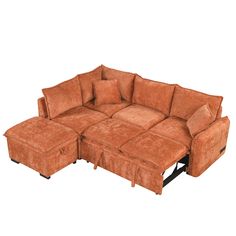 a brown sectional couch with pillows on the top and bottom end, sitting in front of a white background